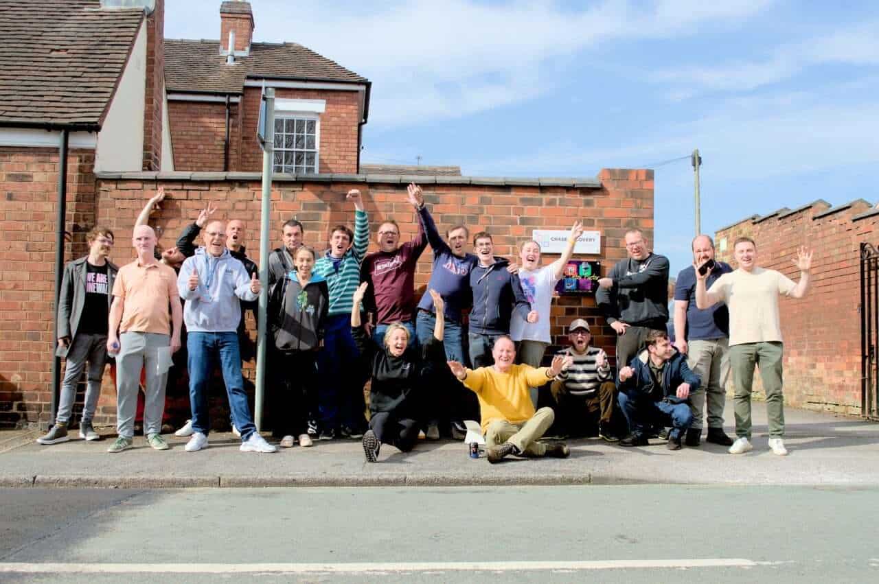 Celebrating team success outside at The Detox Factor with a lively group photo.
