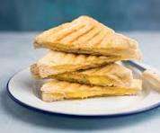 Cheese toastie on a plate, perfect for a quick lunch break.