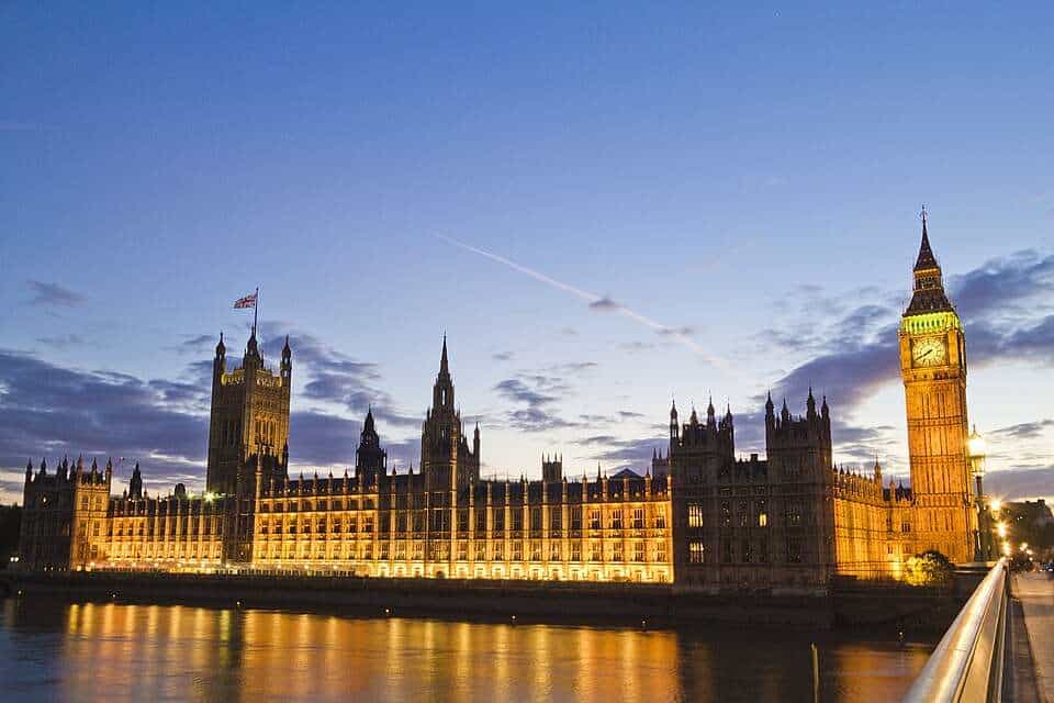 London Parliament and Big Ben at sunset, showcasing iconic UK landmarks with beautiful lighting.