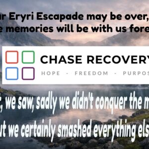 Scenic view of mountains and lake in Eryri with recovery message.