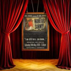 Theatre stage with "Wake Up Sammy" poster and red curtains.